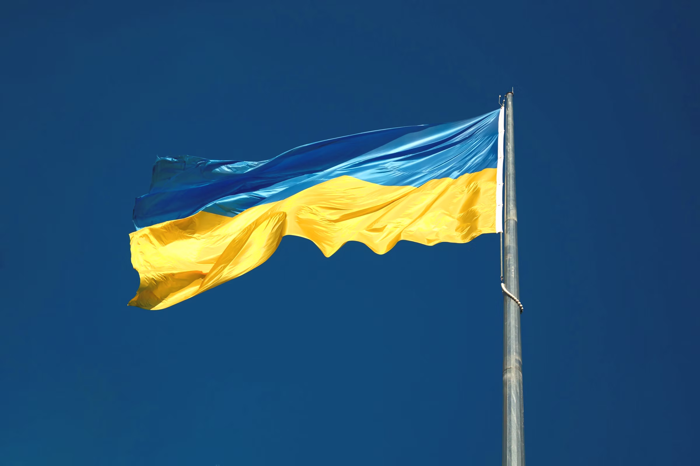 Ukrainian flag — symbolising the difficult situation around Yuliia’s family and homeland during this phase.