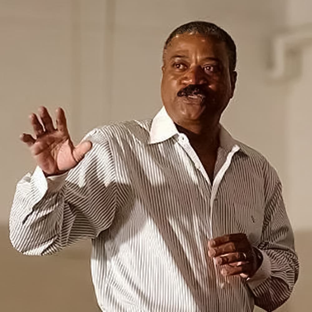 Benny J. Sims Jr. explaining a tennis strategy